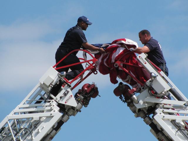Preparing the flag of the United States of America in honor of Sergeant Hector Alaya.
<br><br>
End of Watch - 4 April 2010
